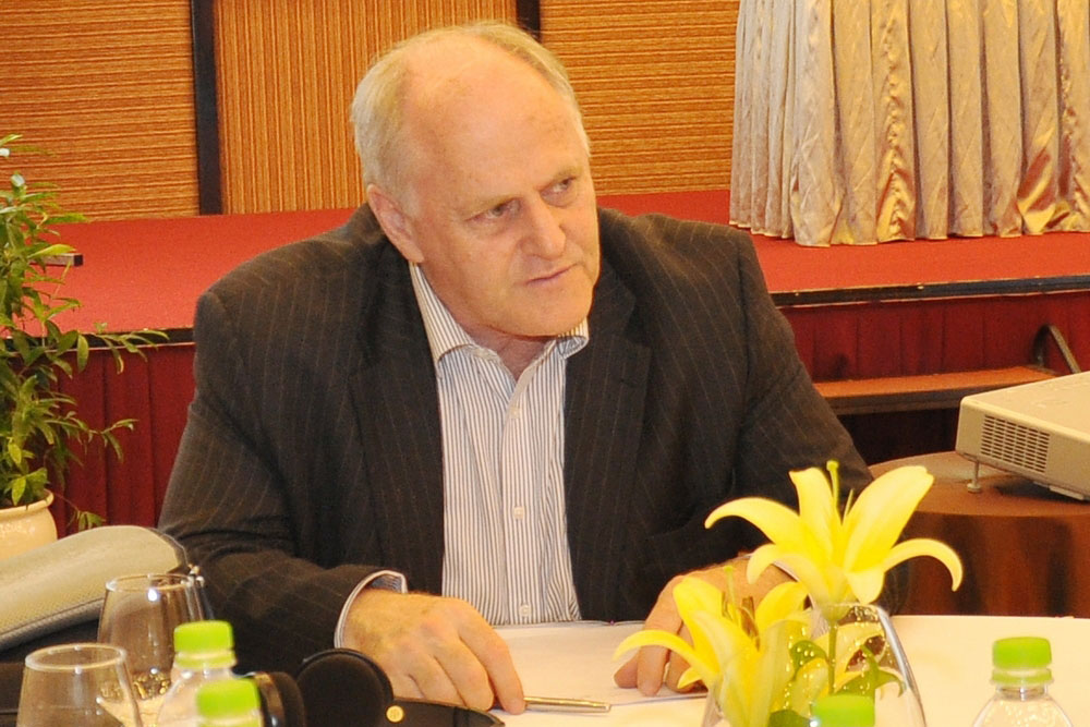 Dr Leslie Sims sitting at a conference