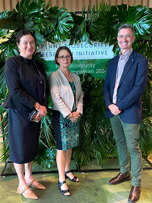 Image of Dr Jo Luck, Program Director of the PBRI with Gabrielle Vivian-Smith and Department Secretary Adam Fennessy at the PBRI Symposium