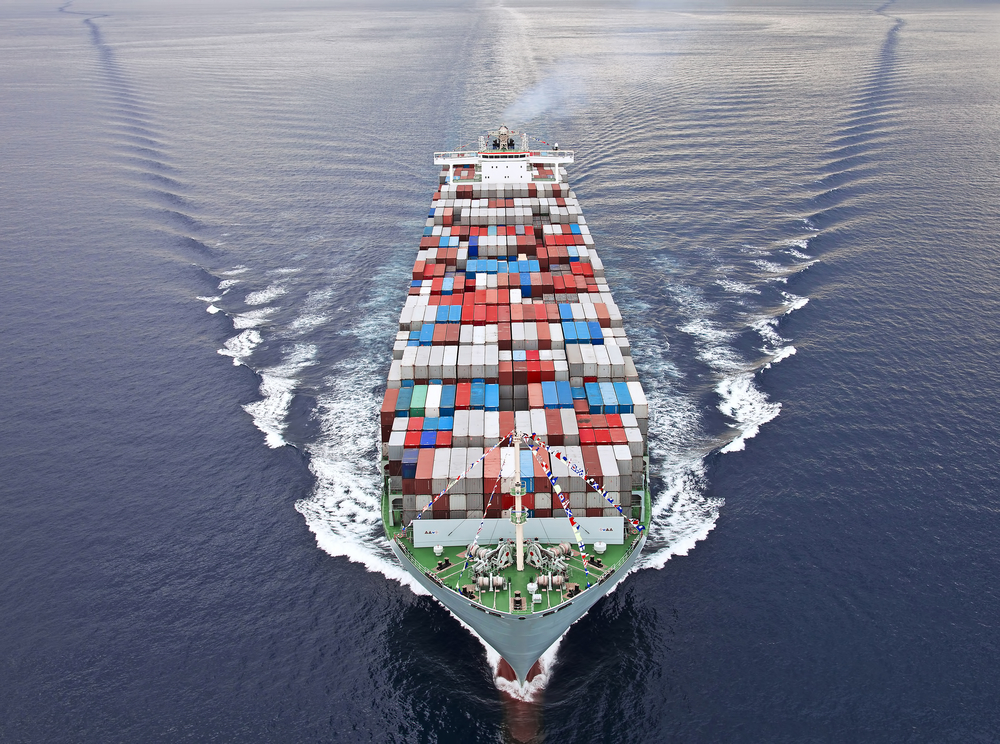 Container ship sailing on ocean