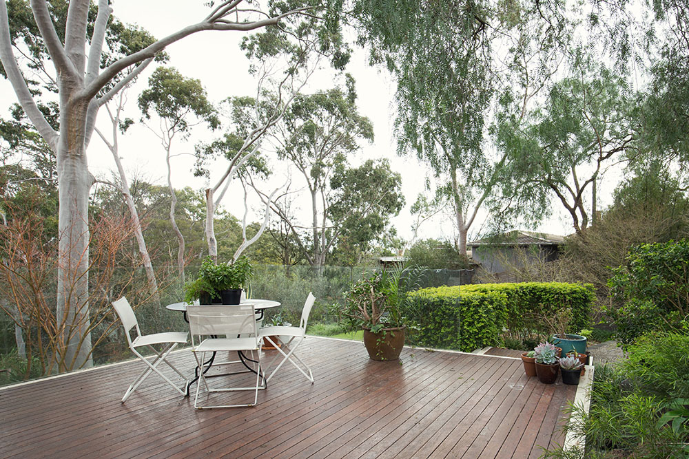 Deck patio amongst native Australian landscaping and gum trees