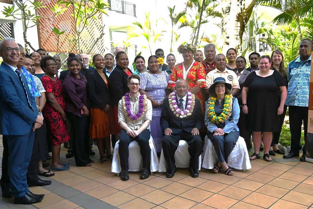 Image of a group of people, three seated, many others standing behind them. They are (seated, left to right) Scott Mersch, Director, Codex Australia, Australian Department of Agriculture, Fisheries and Forestry; Dr Andrew Tukana, Permanent Secretary, Fiji Department of Agriculture and Waterways (and Codex Regional Coordinator); and Mary Frances Lowe, Manager, United States Codex Office, US Department of Agriculture.