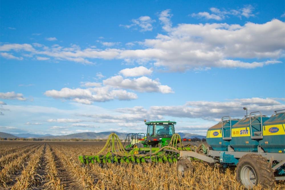 Image of harvesting equipment in a field of grain