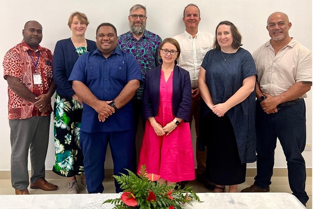 Image of a group of people posing for the camera